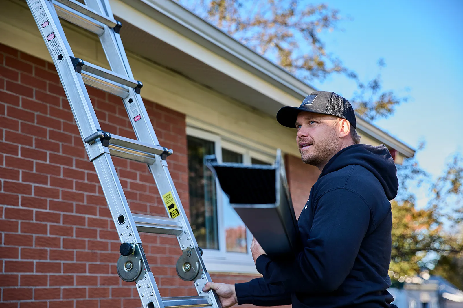 Crew moving material on a residential site — Westpoint Gutters, Vancouver ON